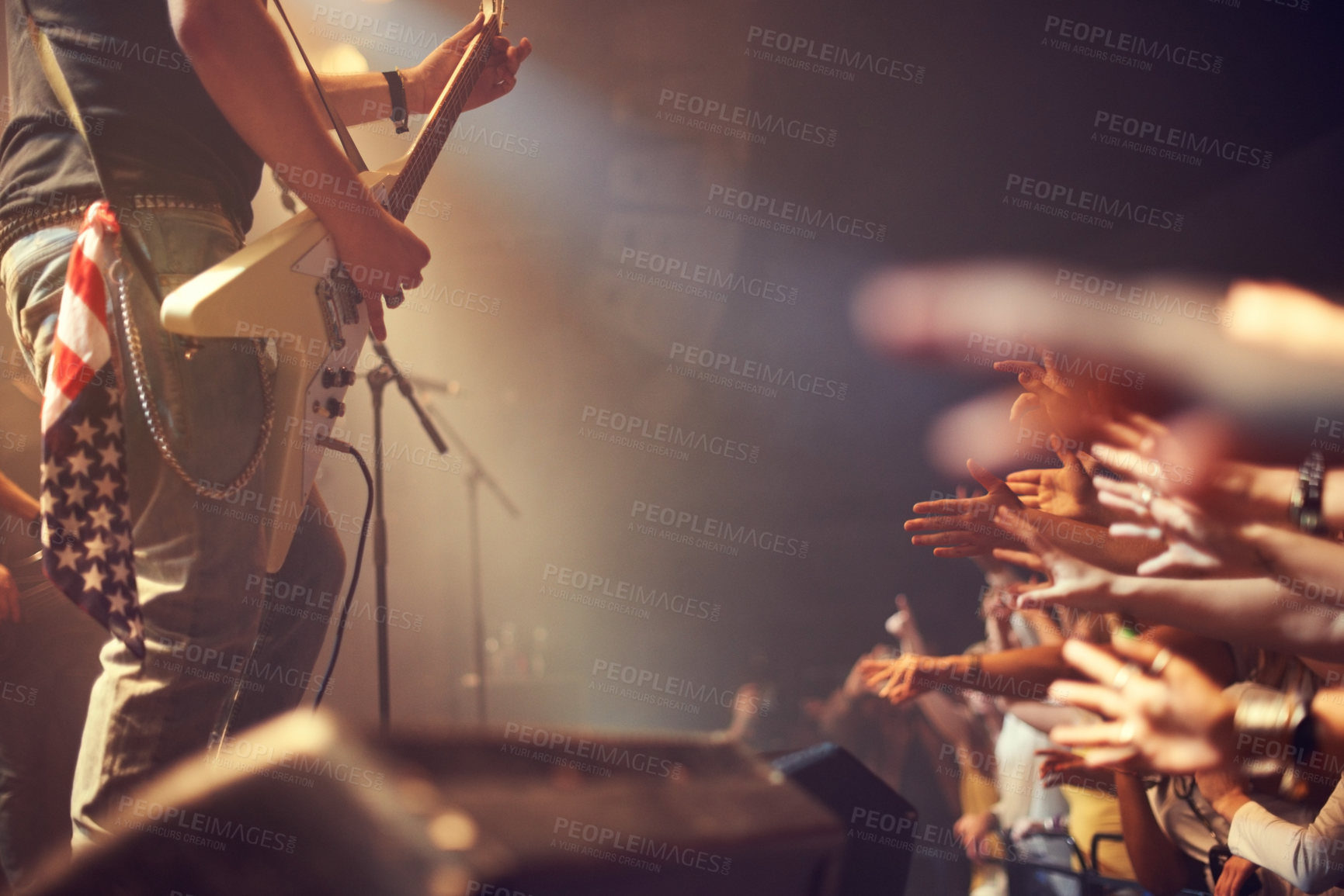 Buy stock photo Music artist, concert and playing guitar on stage for party, crowd or audience at a festival. Guitarist or rockstar in rock and roll band performing for fans at night event, club or music festival