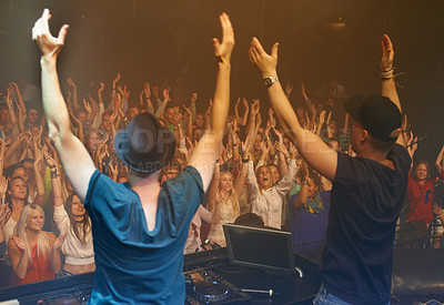 Buy stock photo Concert, party or dj at a dance festival for a music performance or celebration with happy fans or crazy audience. Stage, hands up or musicians dancing with a crowd at a new years rave event in Ibiza