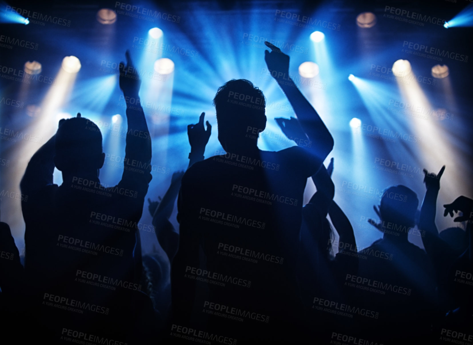 Buy stock photo Silhouette of a crowd of young adults at a concert