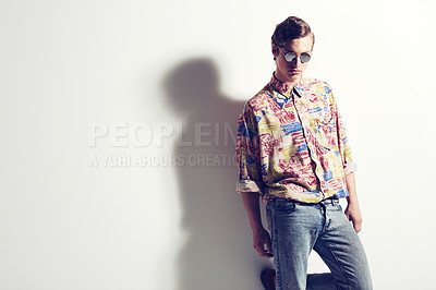 Buy stock photo Shot of a stylish man posing in a studio