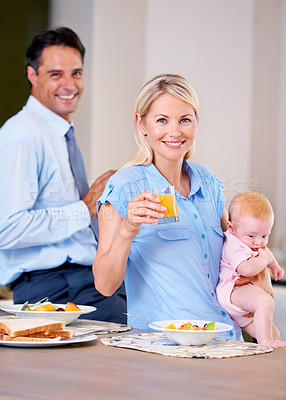Buy stock photo Family, baby and house with breakfast, love and family with fruit, health and wellness. Parents, daughter and orange juice with routine, morning and kitchen for portrait, happy and face for mom