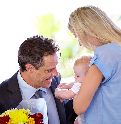 Buy stock photo Coming home, flowers and parents with baby in a house with love, support and bonding with gratitude. Happy family, bouquet and business man with floral surprise for first mothers day celebration