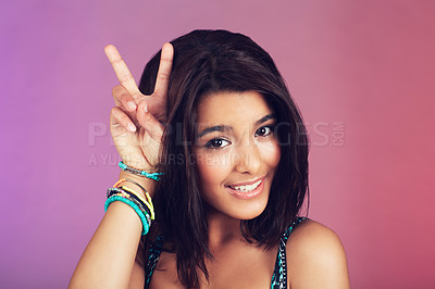 Buy stock photo Studio, woman and portrait with closeup, peace sign and beauty with smile, confidence and face. Latino teen, happy and purple background with cool, bracelet and hipster for youth, color and style 