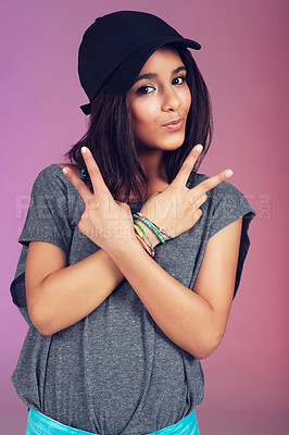 Buy stock photo Studio, woman and portrait with cap, peace sign and clothes for happy, youth and hipster. Latino teen, fashion and pink background with bracelet, empowerment and confidence with trendy, cool and hat