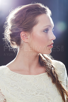 Buy stock photo A young elegant woman posing in a studio