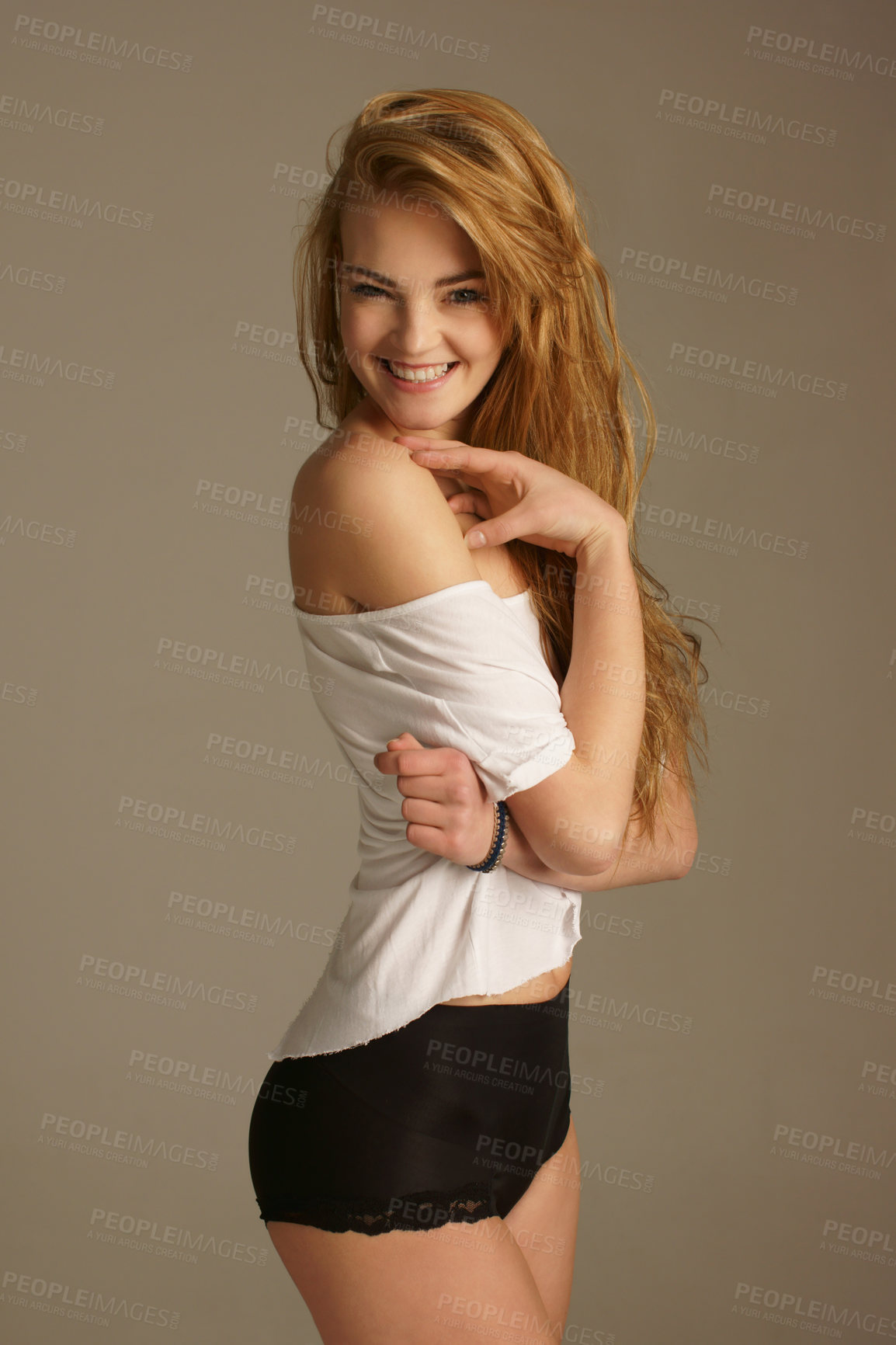 Buy stock photo Sexy, happy and portrait of woman in studio with lingerie for playful flirting, seductive and confidence. Beauty, happiness and face of isolated beautiful woman on beige background with flirty smile