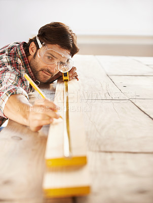 Buy stock photo Man, wood and carpenter with idea, planning and building for home improvement, remodeling and renovation. Handyman, craftsman and contractor with maintenance, wood and skill for measurement or repair