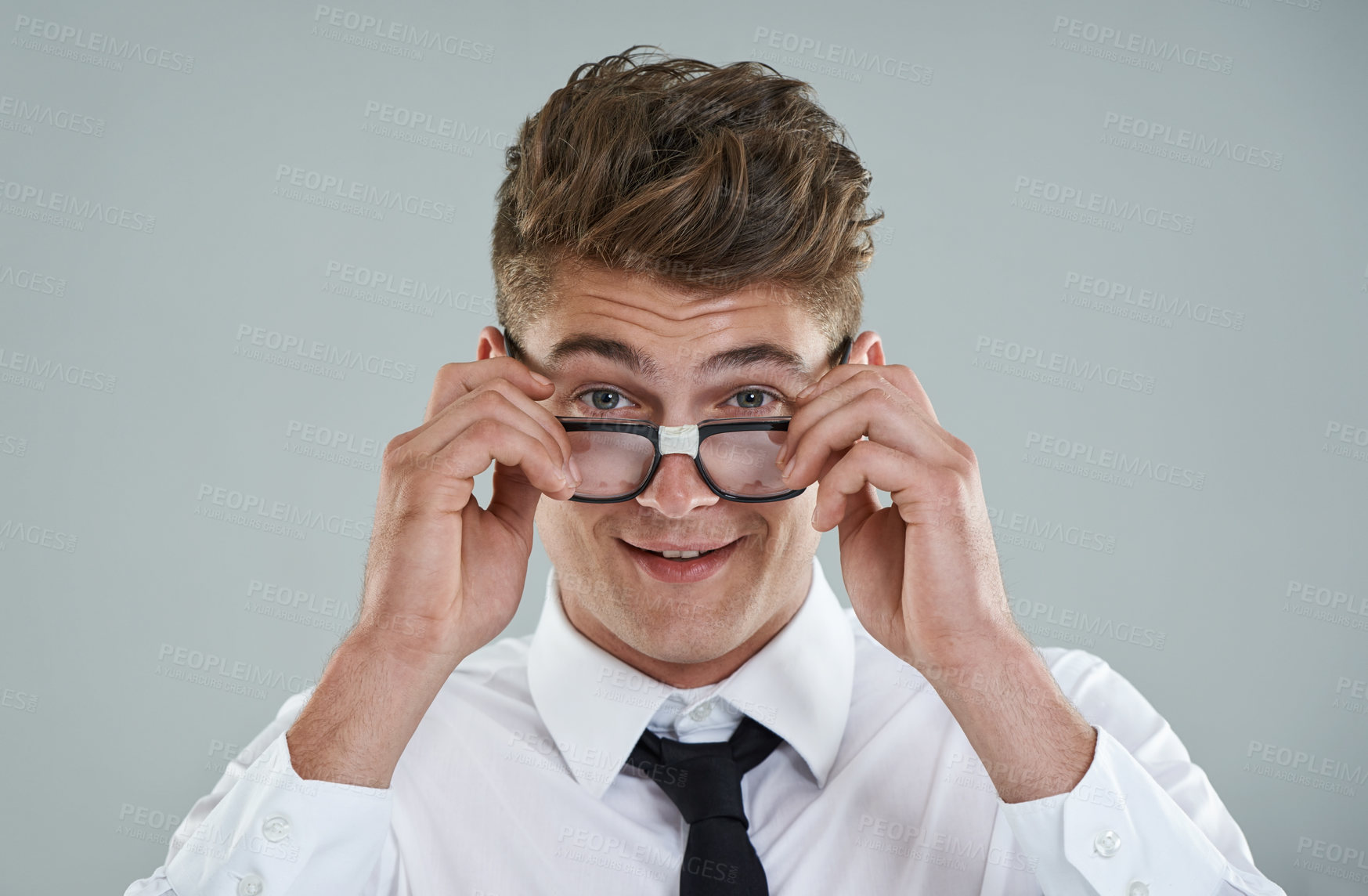 Buy stock photo Businessman, glasses and portrait in studio for optical healthcare, smile and confidence on gray backdrop. Male person, eyewear and proud of frame choice, optometry and lens for vision support