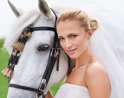 Buy stock photo Portrait of a gorgeous blonde bride standing alongside her stallion
