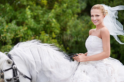 Buy stock photo Wedding, bride and riding with horse or portrait outdoor with happiness for celebration, marriage and confidence. Woman, person and stallion on lawn in field with smile, dress and animal at ceremony