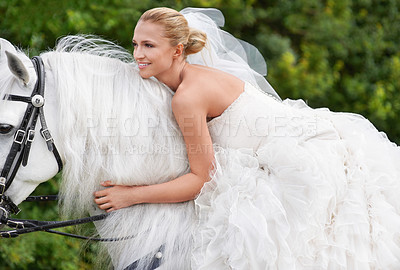 Buy stock photo Bride, woman and riding with horse outdoor or happiness for celebration, marriage and confidence in countryside. Wedding, person and stallion on lawn in field with smile, dress and animal at ceremony