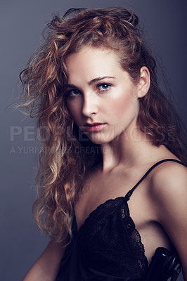 Buy stock photo An attractive young woman in lingerie looking at the camera