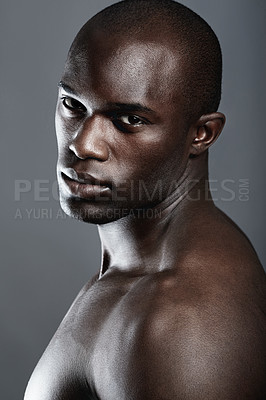 Buy stock photo Beauty, serious portrait of black man and studio background with muscle fitness and skin glow aesthetic. Health, wellness and face of sexy African bodybuilder or male model isolated on grey backdrop.