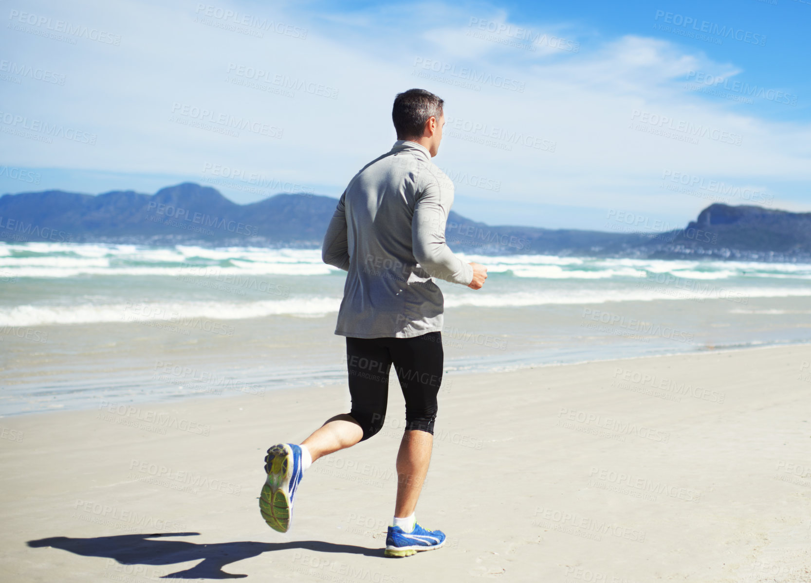 Buy stock photo Back, space or man at beach running for exercise, training or outdoor workout at sea for fitness. Sports person, mature runner or healthy athlete on sand for cardio endurance, wellness or mockup 