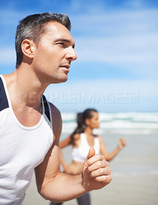 Buy stock photo Mature, man or people on beach running for exercise, training or outdoor workout at sea. Sports couple, runners or healthy athletes in nature for fitness endurance, wellness or challenge on sand