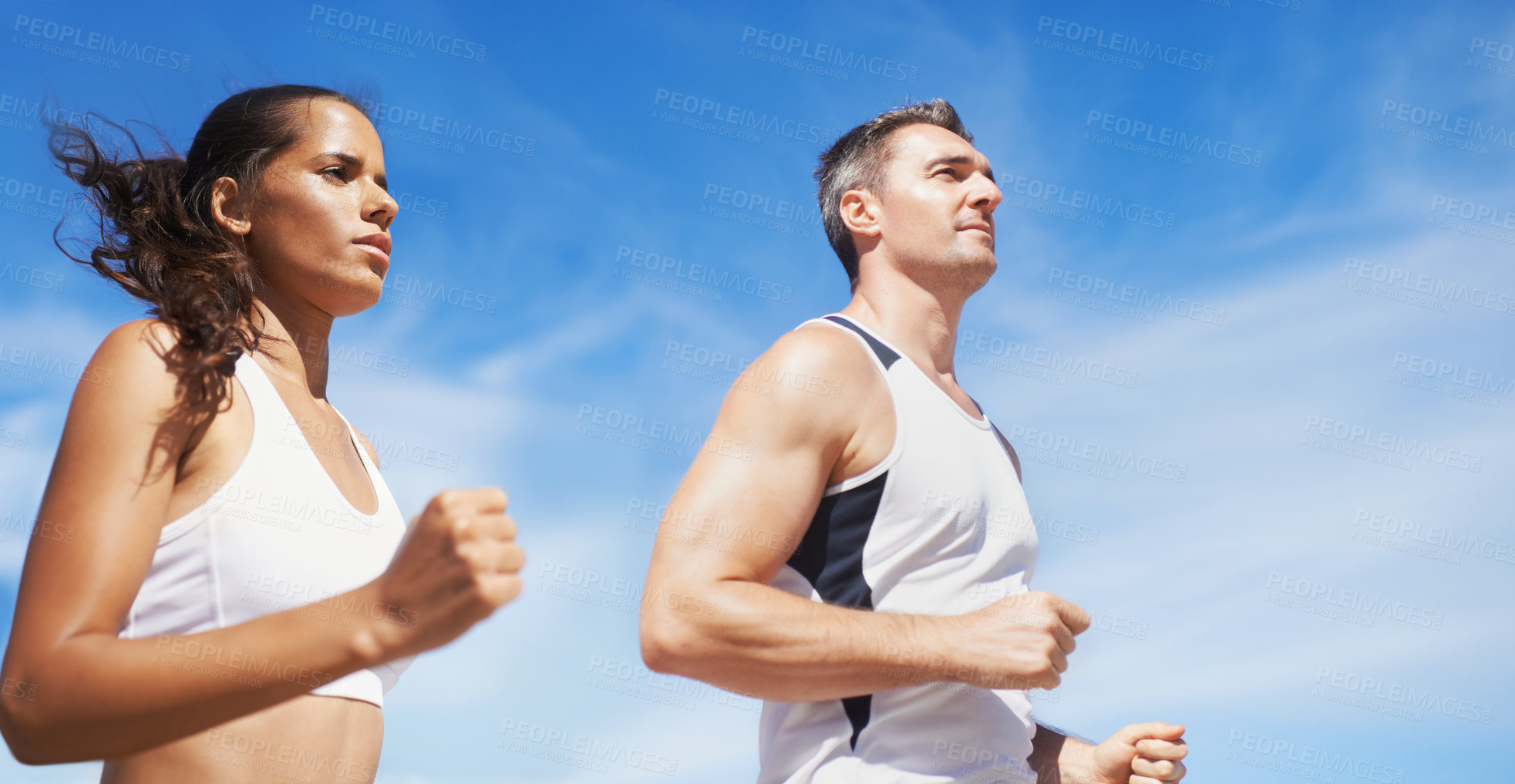 Buy stock photo Running, beach and couple with fitness, summer and weekend break with cardio and training for wellness. Runners, seaside and man with woman and support with practice and activity for health and hobby