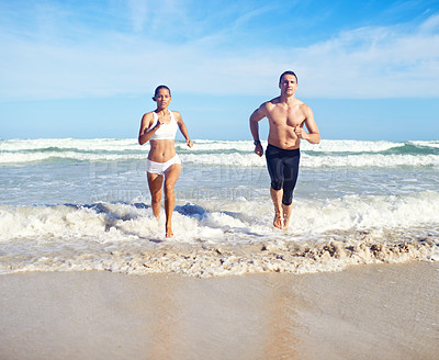Buy stock photo Running, beach and couple with fitness, waves and weekend break with cardio and training for health. Runners, seaside and man with woman and support with practice and activity for wellness and hobby
