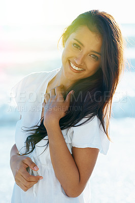Buy stock photo Arab woman, beach and smile for ocean, waves and breeze for summertime in Bali for vacation. Female, sea and holiday relaxation abroad in swimsuit, sand and happy for portrait, memories and trip. 