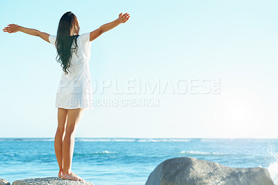 Buy stock photo Beautiful woman on the beach with her arms outstretched