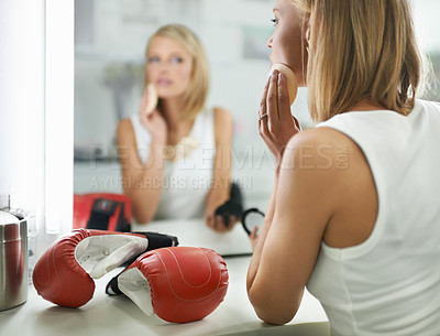 Buy stock photo Female person, bruise and boxing gloves by mirror, makeup and stylish outfit in dressing room. Woman, blush and eyeshadow for sport match, reflection and fashion to prepare for post interview
