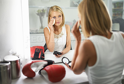 Buy stock photo Woman, bruise and boxing gloves by mirror, makeup and stylish outfit in dressing room. Female person, blush and eyeshadow for sport match, reflection and fashion to prepare for post interview
