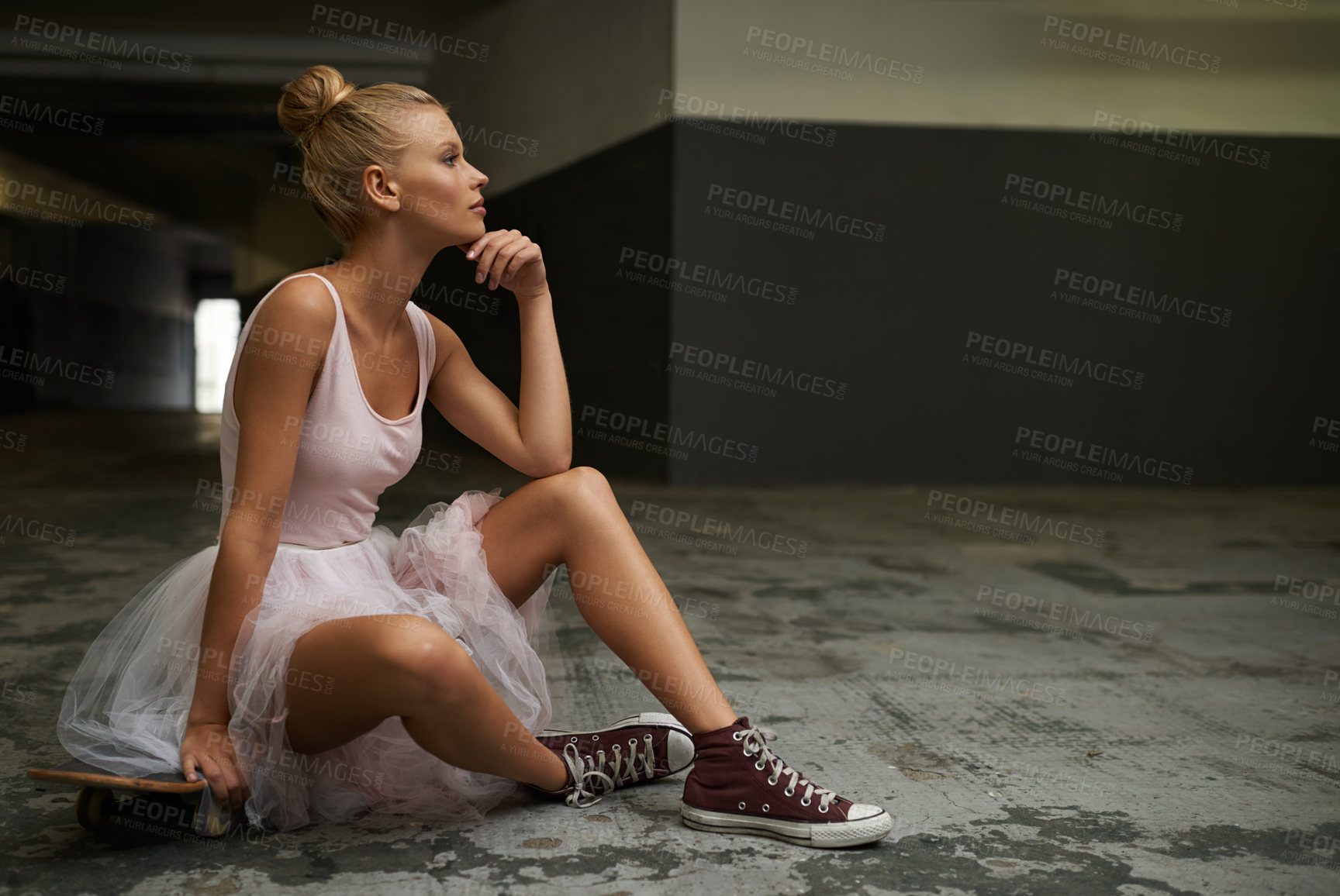Buy stock photo Thinking, ballet and woman with skateboard and sneakers for edgy fashion, trendy outfit and hipster style. Parking lot, aesthetic and ballerina on floor for dance hobby, sports and skating skill