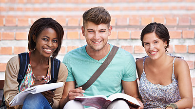 Buy stock photo Portrait of three smiling students on the steps of their college campus
