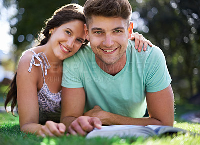 Buy stock photo Happy, grass and portrait of couple with books for reading, learning and studying together outdoors. University, college and man and woman with textbook in park for bonding, relax and rest on campus