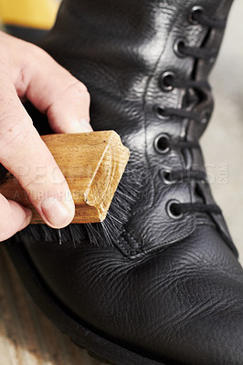 Buy stock photo Cropped closeup shot of a soldier polishing his boots
