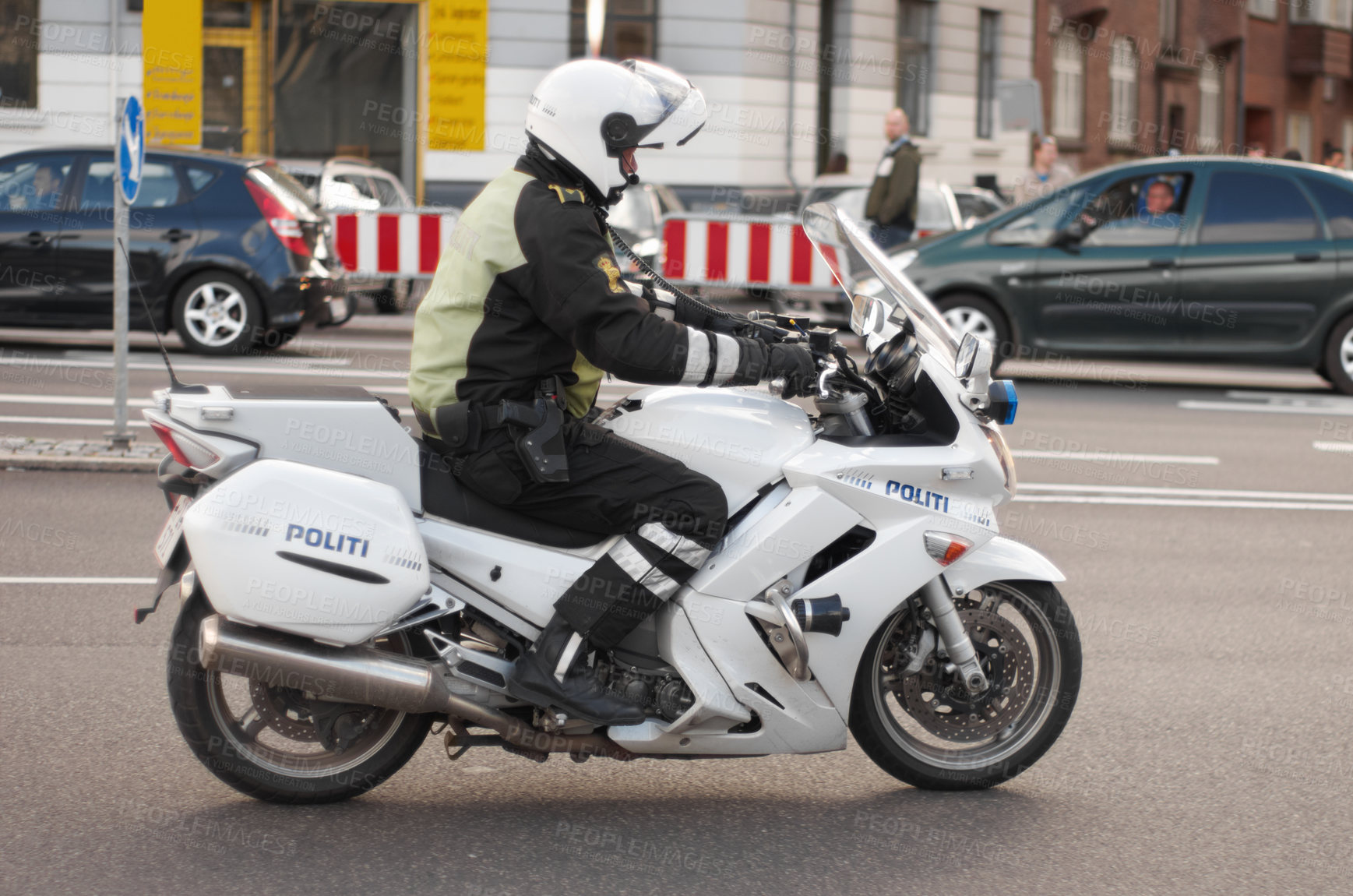 Buy stock photo Police, motorbike and road safety officer working for protection and peace in an urban neighborhood in Denmark. Security, law and legal professional or policeman on a motorcycle ready for service