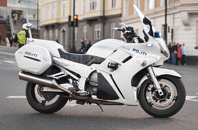 Buy stock photo Police, motorcycle and transportation vehicle in city, safety and law enforcement on urban road, empty street and Norway. Security, motorbike and travel for public service, legal power and authority
