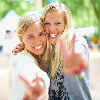 Buy stock photo Peace hands, portrait and women friends hug in a park with freedom, fun and bonding in nature together. V sign, face and people embrace in a forest for travel, vacation or weekend reunion outdoor