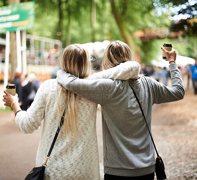 Buy stock photo Two friends having fun at a festival