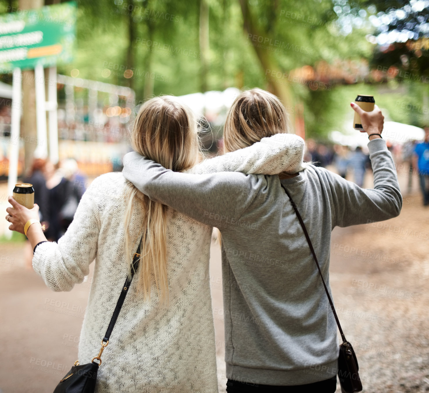 Buy stock photo Two friends having fun at a festival