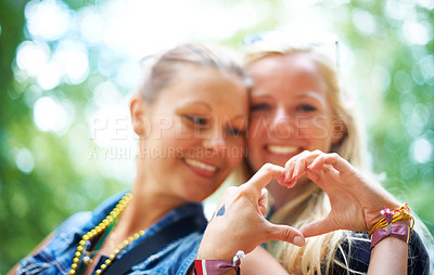 Buy stock photo Friends, heart gesture and smile at festival to party, celebrate and summer in California for bonding, enjoy and entertainment. Event, outdoor and happiness at concert with music for enjoyment 