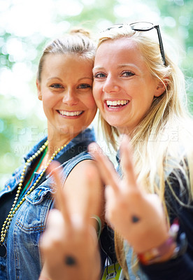 Buy stock photo Two friends having fun at a festival