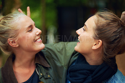 Buy stock photo Women, happy and smile in forest for connection, bonding and unity outdoors together in nature. Female friends, gaze and affection in woods for walk, socialising and adventure with joy in Australia