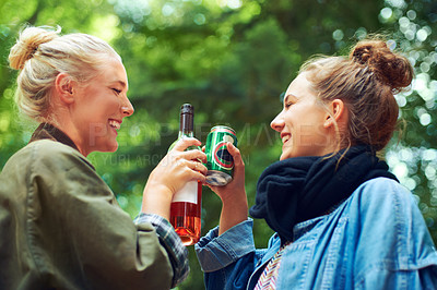 Buy stock photo Friends, cheers and drinks at music festival in forest, excited and beer for bonding together by trees. Women, drinking and celebration in summer on holiday adventure and reunion by concert in woods