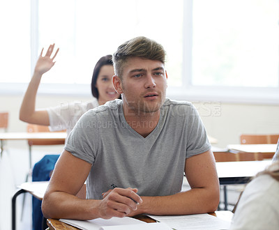 Buy stock photo Man, learning and thinking in classroom at desk for education, knowledge and development at university. Male student, college and wonder in lecture for ideas, study and sitting on seat at campus