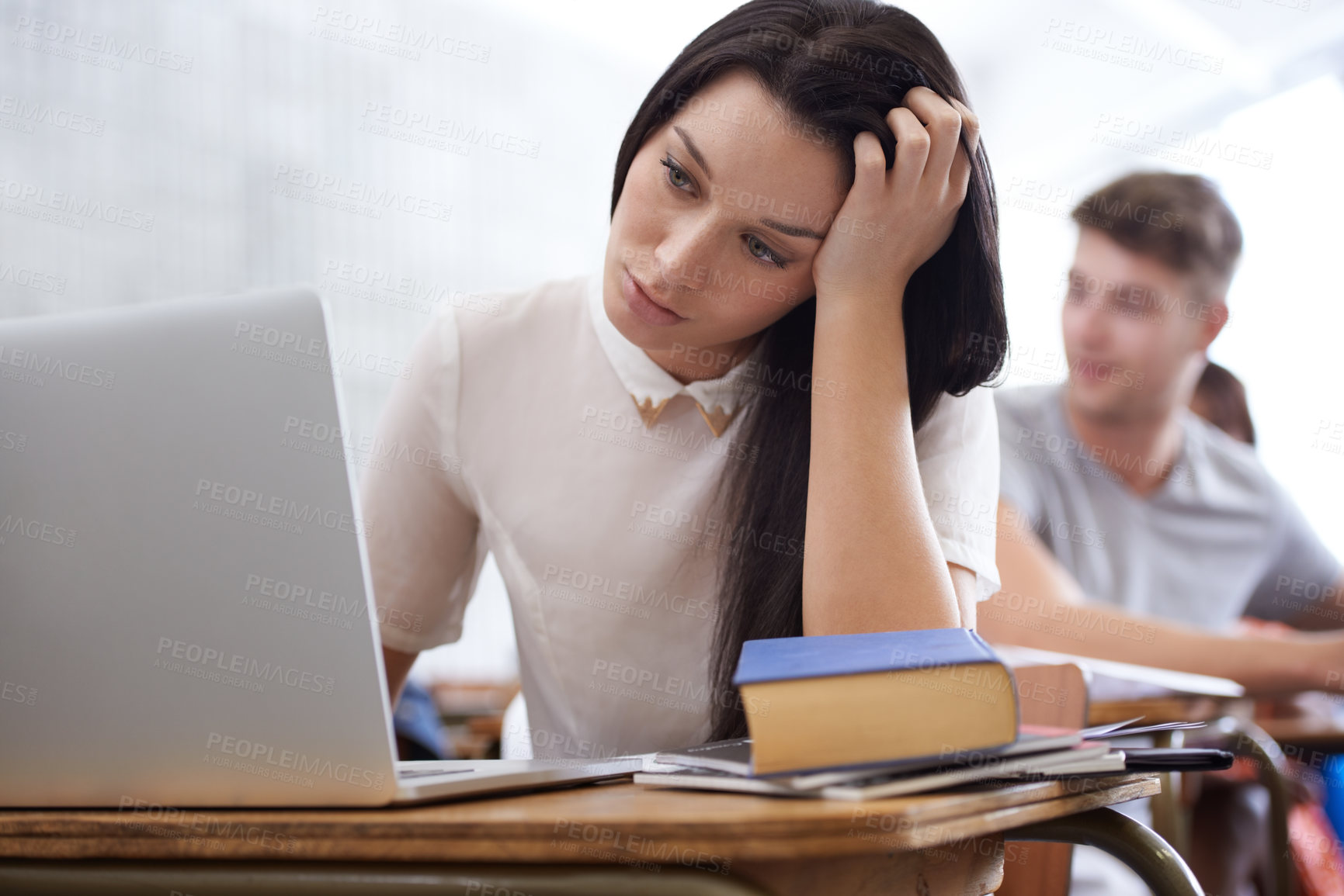 Buy stock photo University, stress and woman in classroom with laptop for development in learning, opportunity and future. Education, anxiety and computer, tired college student with books studying for exam or test.
