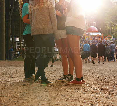 Buy stock photo Legs, forest and group of friends at festival together for social event, party or summer celebration. Flare, crowd and people in woods for talking, bonding or free time in nature with audience