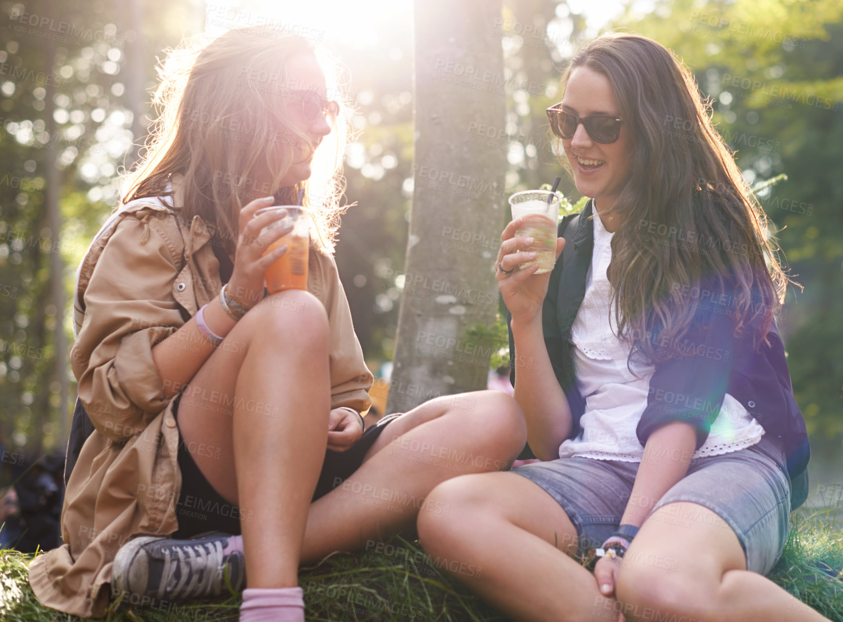 Buy stock photo Flare, beer and woman friends in forest, drinking alcohol together for event, fun or party in summer. Smile, nature and festival with happy young people outdoor in woods for social celebration