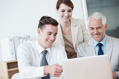 Buy stock photo Computer, meeting and business people in discussion in office for corporate legal project. Conversation, technology and professional team of lawyers working on laptop by desk together in workplace.