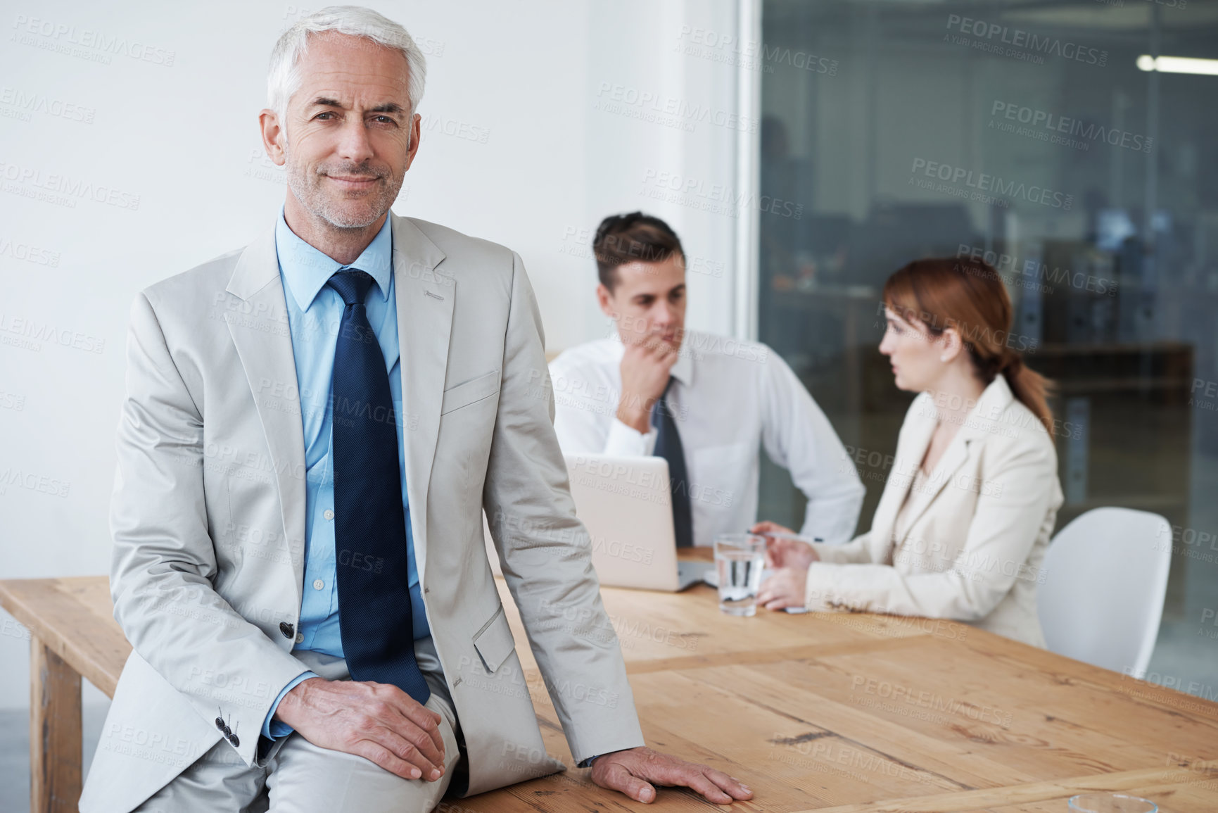 Buy stock photo Portrait, smile and business man on table in boardroom of office for meeting, planning or management. Leadership, training or education with confident mature manager in workplace for employee growth