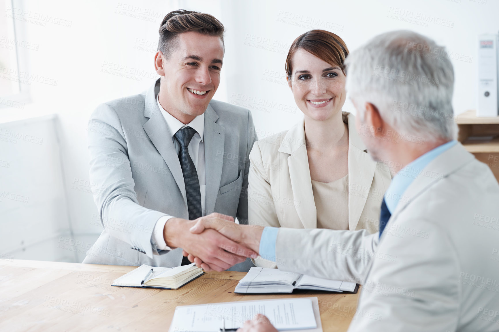 Buy stock photo Shaking hands, happy business people or deal for partnership agreement or b2b offer in meeting. Handshake, smile or excited corporate lawyers in collaboration for teamwork with contract or paperwork
