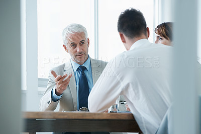Buy stock photo Business people, talking and contract paperwork for meeting, strategy or notes at office. Group, teamwork or employees with documents or negotiation in collaboration for brainstorming at workplace