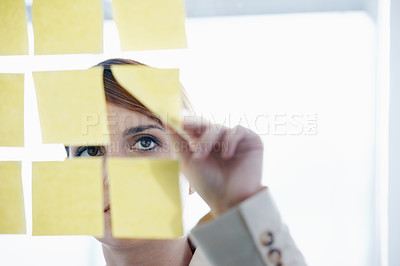 Buy stock photo Employee, sticky notes and glass wall for logistics, thinking and vision for planning and ideas. Businesswoman, brainstorming and mockup for meeting, goals and teamwork for project management