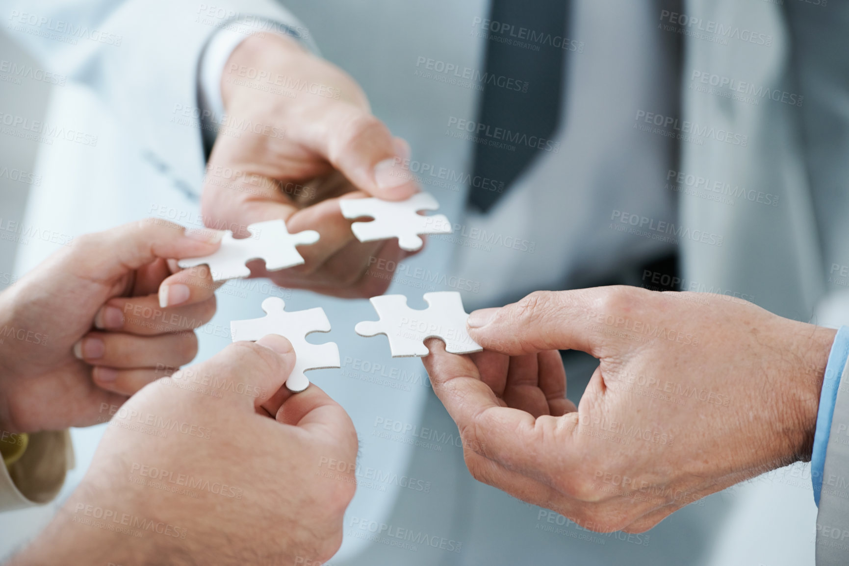 Buy stock photo A business concept image of puzzle pieces fitting together - closeup