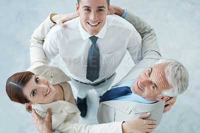 Buy stock photo Business people, portrait and huddle for solidarity or unity in workplace, teamwork and together. Coworkers, top view and support in community or staff in office, collaboration and hug in meeting