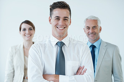 Buy stock photo Shot of a three corporate coworkers in an office
